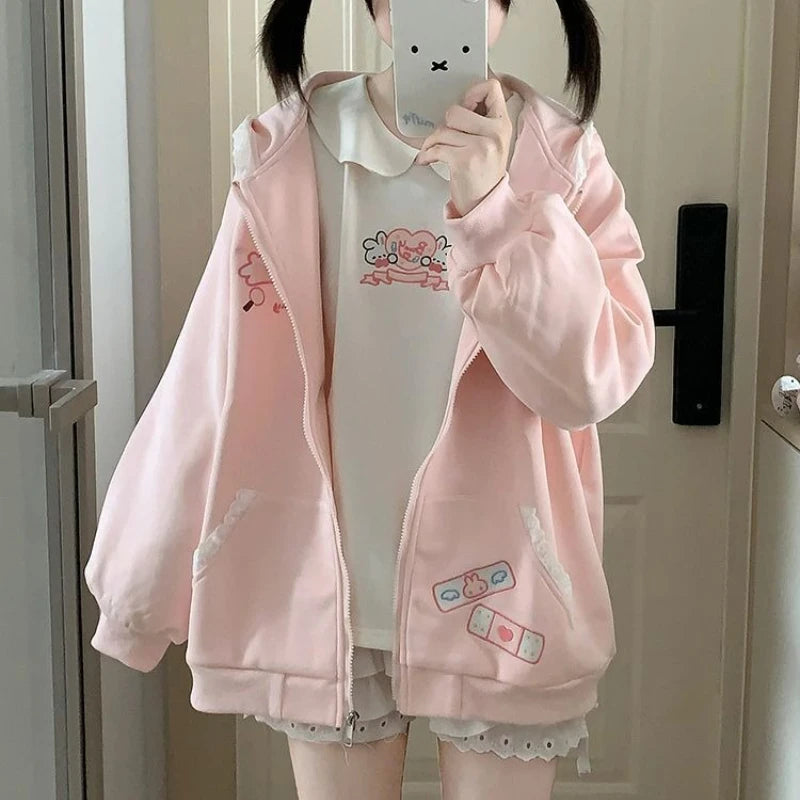 kawaii pink bunny ear zip-up hoodie cutecore harajuku style worn open over white tee mirror selfie
