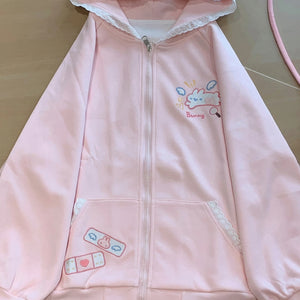 kawaii pink bunny zip-up hoodie flat lay front view lace trim pocket band-aid print cutecore